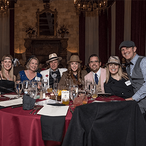 Austin Murder Mystery party guests at the table